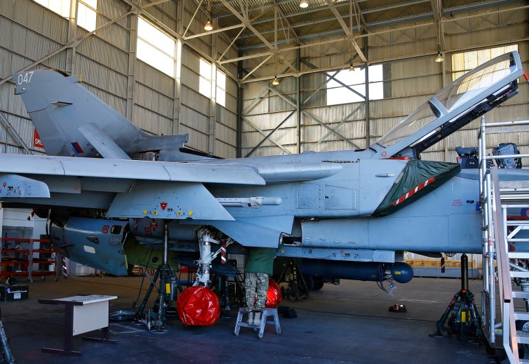 British Royal Air Force personnel work on a Tornado at RAF Akrotiri in southern Cyprus December 5, 2015. REUTERS/Darren Staples