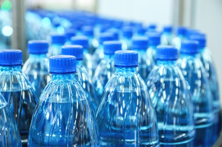 Closeup mineral water bottles raw and lines