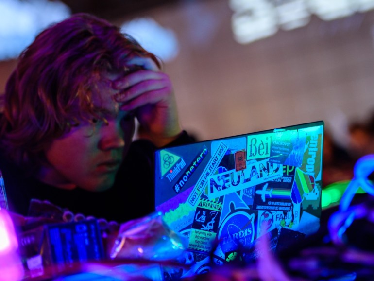 LEIPZIG, GERMANY - DECEMBER 27: A participant sits at a computer on the first day of the 35C3 Chaos Communication Congress on December 27, 2018 in Leipzig, Germany. The three-day event brings together 16,000 hackers, artists, researchers, technology fans and others from across the globe for seminars and workshops on privacy, security, social issues, ethics, government, science and other issues in their relation to digital technology. (Photo by Jens Schlueter/Getty Image