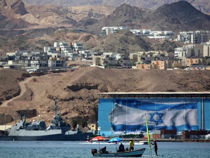 A civil boat is seen with the backround of Israeli naval port in Eilat during the unloading of the Klos-C ship containers by the Israel Defense Forces for security check in the Red Sea, Israel, 10 March 2014. Israel on 05 March had intercepted a cargo vessel in the Red Sea carrying dozens of advanced rockets. Israel believes the missiles were meant to be delivered to militants in the Gaza Strip, as they said they had been tracking the missiles movements for months. The Syrian-made M-302 rockets have a range of up 160 kilometres with warheads of up to 150 kilogrammes, Israeli officials said.
