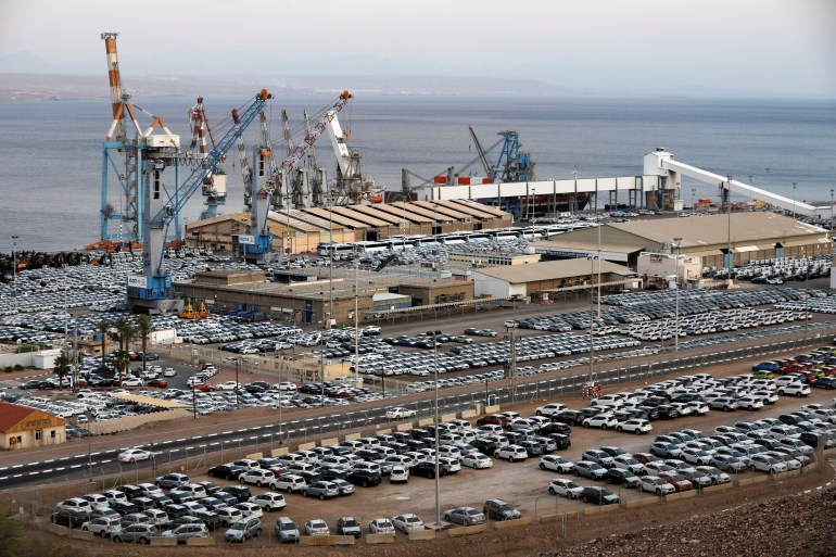 New imported cars are seen in a parking lot next to the Eilat port
