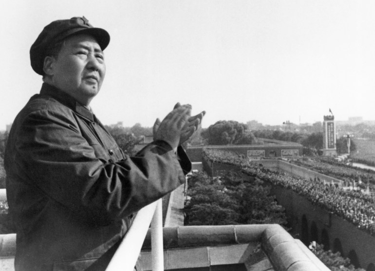 (Original Caption) Mao Tse-Tung on a balcony clapping his hands. Undated photograph.