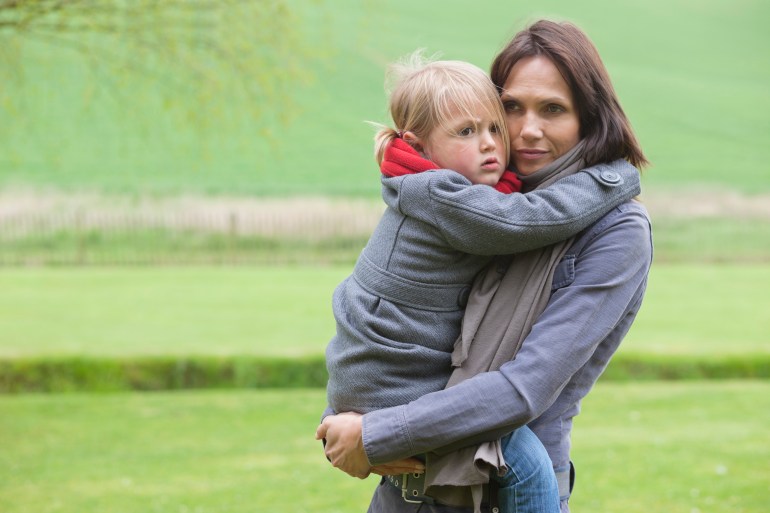 4-5 years; 40-44 years; belgium; blond hair; brown hair; care; carrying; casual clothing; caucasian appearance; child; childhood; countryside; daughter; day; family; family with one child; female bonding; focus on foreground; girls; happiness; horizontal; jacket; lasne; lawn; lifestyles; looking at camera; love; mature adult; mature women; mother; one parent; outdoors; park; playing; portrait; preschooler; scarf; side view; smiling; standing; three-quarter length; togetherness; two generation family; two people; waist-up; women