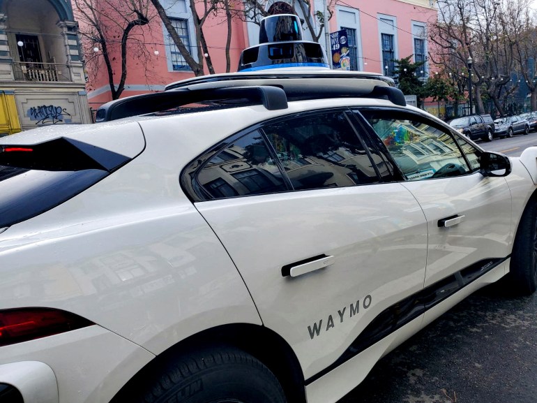 FILE PHOTO: A Waymo rider-only robotaxi is seen during a test ride in San Francisco, California, U.S., December 9, 2022. REUTERS/Paresh Dave/File Photo/File Photo/File Photo