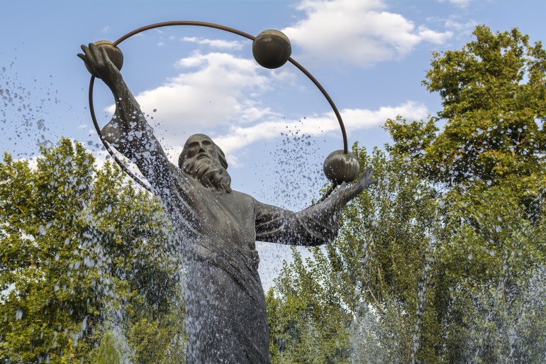 TEHRAN, IRAN - June 22, 2016: Al-Biruni statue in the middle of fountains in Laleh park. Al-Biruni is regarded as one of the greatest scholars of the medieval Islamic era.