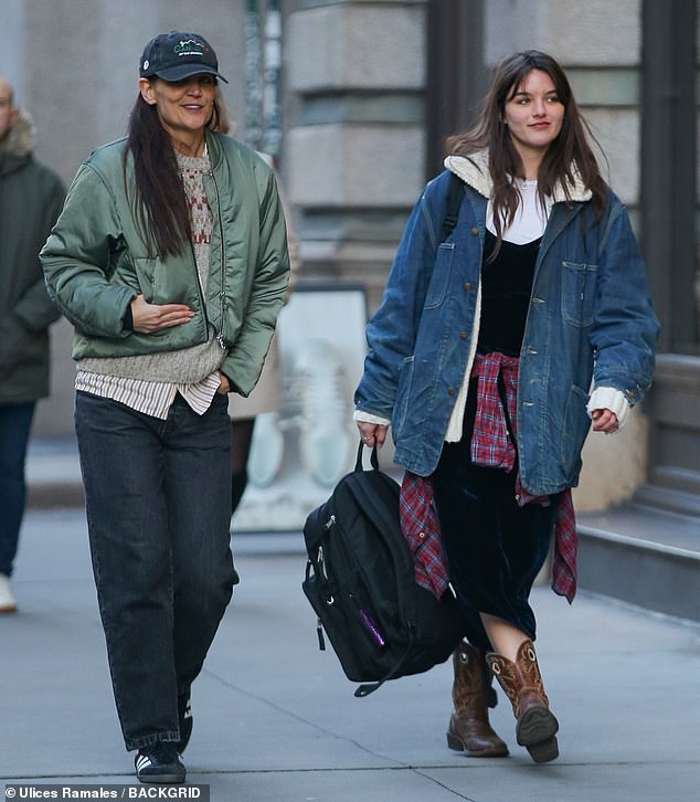 The Dawson's Creek actress donned a pair of loose-fitting, dark denim trousers as well as a striped button up and gray-patterned sweater to help her stay warm in the cooler temperatures