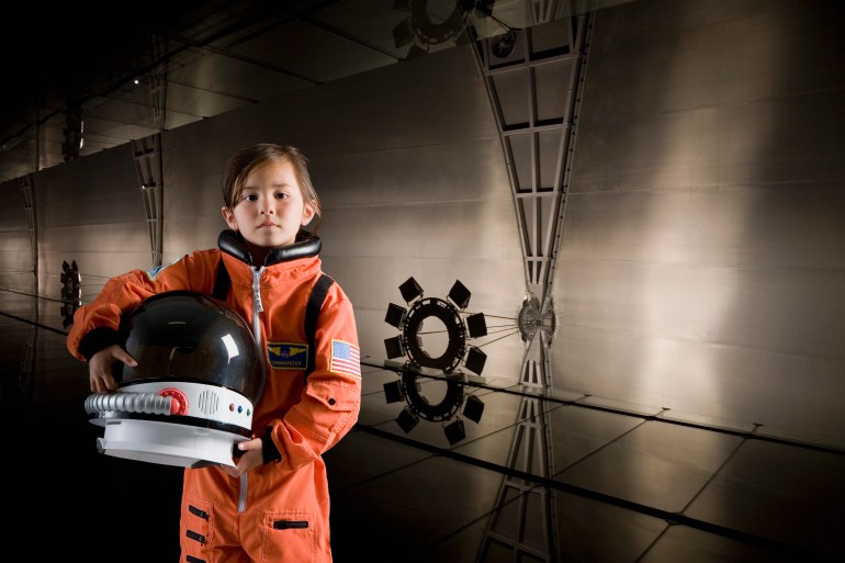 girl-wearing-astronaut-costume-portrait