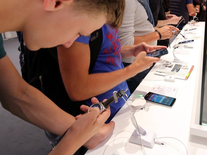 Visitors check out the latest Sony smart watch and smartphone products at the International Consumer Electronics Fair (IFA) in Berlin, Germany, 05 September 2015. The fair takes place from 04 to 09 September 2015.