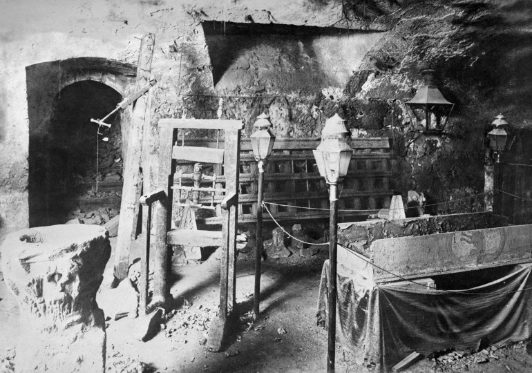 (Original Caption) Ancient torture chamber is shown at its unearthing. Alteration work in the foundations of the Chancellor's Palace at Granada, Spain, resulted in the unearthing of an ancient Spanish torture area, formerly bricked up in the dungeons of the palace. The torture chamber was in the exact state as it was at the time of the Inquisition, with all the old instruments of torture remaining, including the stone brasier at which burning implements were heated. Photo shows a view inside the newly unearthed torture chamber.