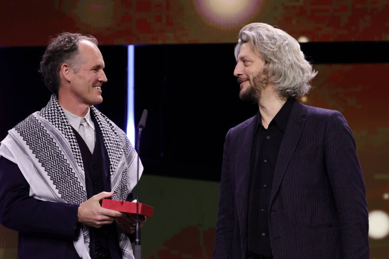 BERLIN, GERMANY - FEBRUARY 24: Ben Russel and Guillaume Cailleau speak on stage after winning the Encounters Award for Best Film for the movie "DIRECT ACTION" at the Award Ceremony of the 74th Berlinale International Film Festival Berlin at Berlinale Palast on February 24, 2024 in Berlin, Germany. (Photo by Andreas Rentz/Getty Images)