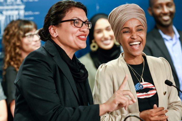 U.S. Representatives Rashida Tlaib (D-MI) and Ilhan Omar (D-MN) react as they discuss travel restrictions to Palestine and Israel during a news conference at the Minnesota State Capitol Building in St Paul, Minnesota, August 19, 2019. REUTERS/Caroline Yang