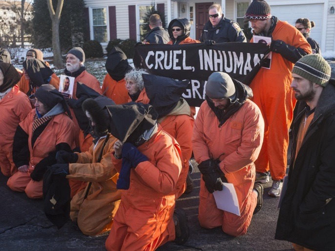 WASHINGTON, DC - JANUARY 10: Activists of Codepink and Witness Against Torture stage demonstrations in front of the CIA director John Brennan's house before protesting at CIA Headquarter in Washington on January 10,2015. The group of roughly 60 people, some of whom had been fasting in solidarity with prisoners at Guantanamo Bay, gathered on the eve of the anniversary of the controversial facilitys opening.