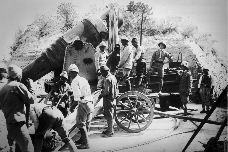 A Photograph of Turkish Men Removing Breach Blocks from the Guns in the Asia Minor Forts under Supervision of Officers of the 9th South Lancs circa 1915. (Photo by Fotosearch/Getty Images)