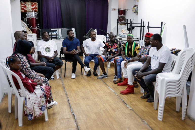 Members of the indigenous Masalit tribe from Darfur in Sudan hold a meeting to discuss news from back home, in the the Masalit tribe community centre in southern Tel Aviv, Israel June 24, 2023. REUTERS/Amir Cohen