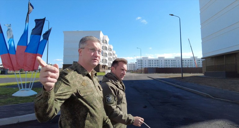 Russian Deputy Defence Minister Timur Ivanov inspects the construction of apartment blocks in Mariupol, Russian-controlled Ukraine, in this still image from video released October 15, 2022. Russian Defence Ministry/Handout via REUTERS ATTENTION EDITORS - THIS IMAGE HAS BEEN SUPPLIED BY A THIRD PARTY. NO RESALES. NO ARCHIVES. MANDATORY CREDIT.